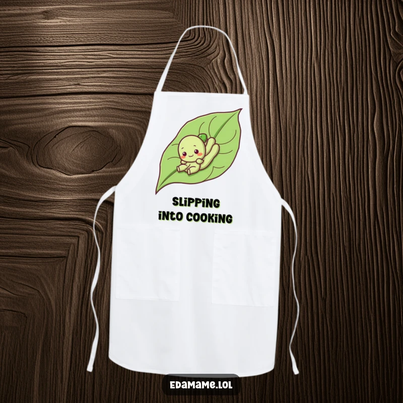 Funny apron showing a cute edamame character sliding down a leaf, ideal for kitchen duty with a humorous and playful theme.