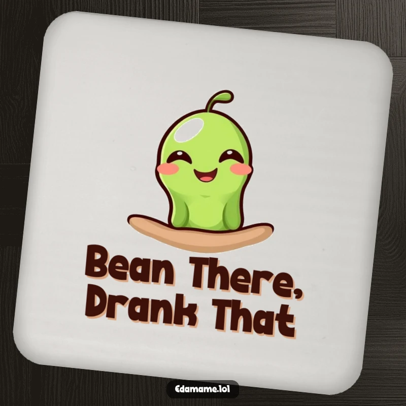 Funny edamame coasters showing a single green bean peeking out with a wide, happy grin, providing humorous and practical surface protection.