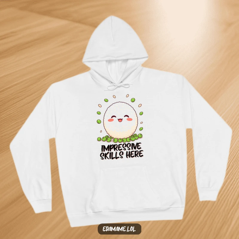 Funny Rice Ball Hoodie: A warm and cozy hoodie featuring a cheerful rice ball character skillfully juggling peas with a smile.