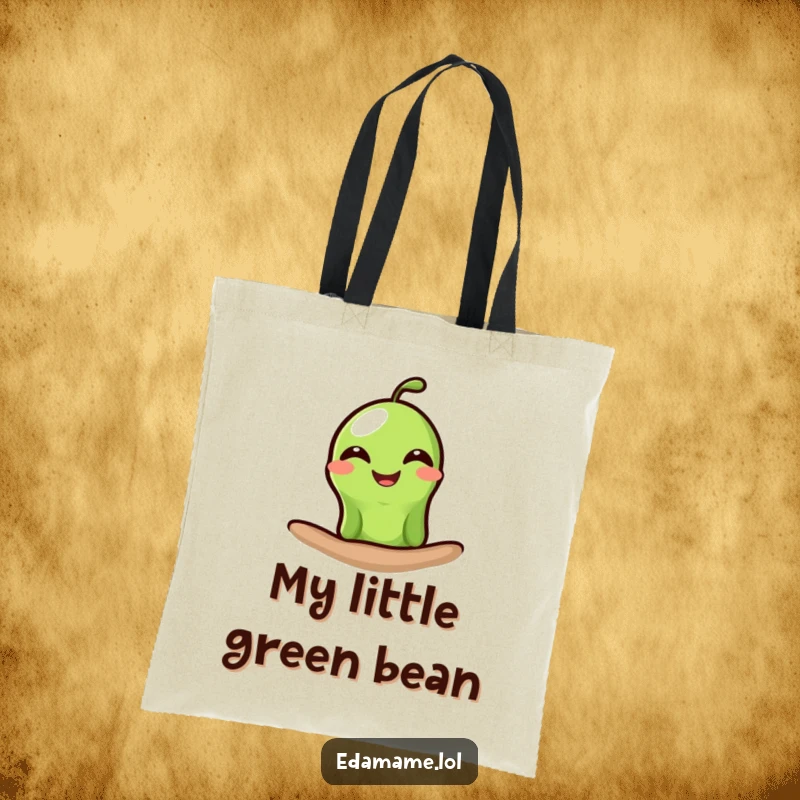 Funny edamame tote bag featuring a single green bean peeking out with a wide, happy grin, ideal for humorous and practical use.