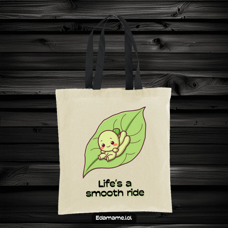Funny tote bag with a cute edamame character sliding down a leaf, perfect for carrying items with a dose of playful humor.