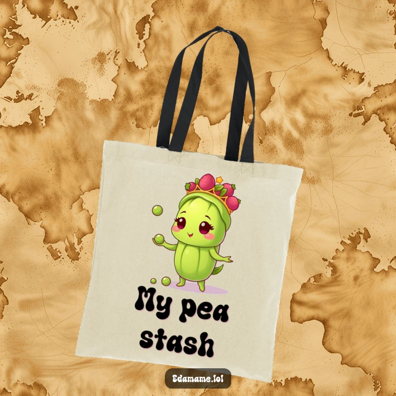 Funny tote bag showcasing an edamame pod in a berry tiara, juggling small peas, perfect for carrying essentials with a splash of humor.